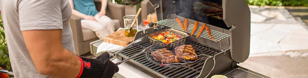 A man grilling on a Weber grill, highlighting outdoor cooking with a high-quality barbecue.